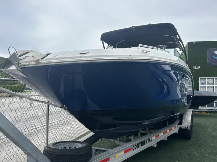  Yacht Photos Pics 2017 Sea Ray SDX 290 Outboard boat on trailer, blue hull, parked outdoors.