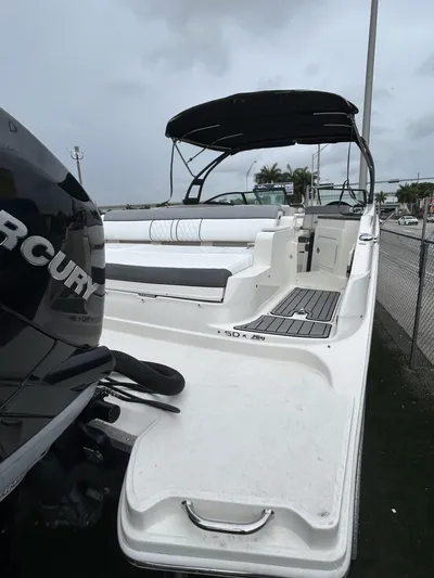  Yacht Photos Pics 2017 Sea Ray SDX 290 Outboard boat with Mercury engine, docked under cloudy skies.