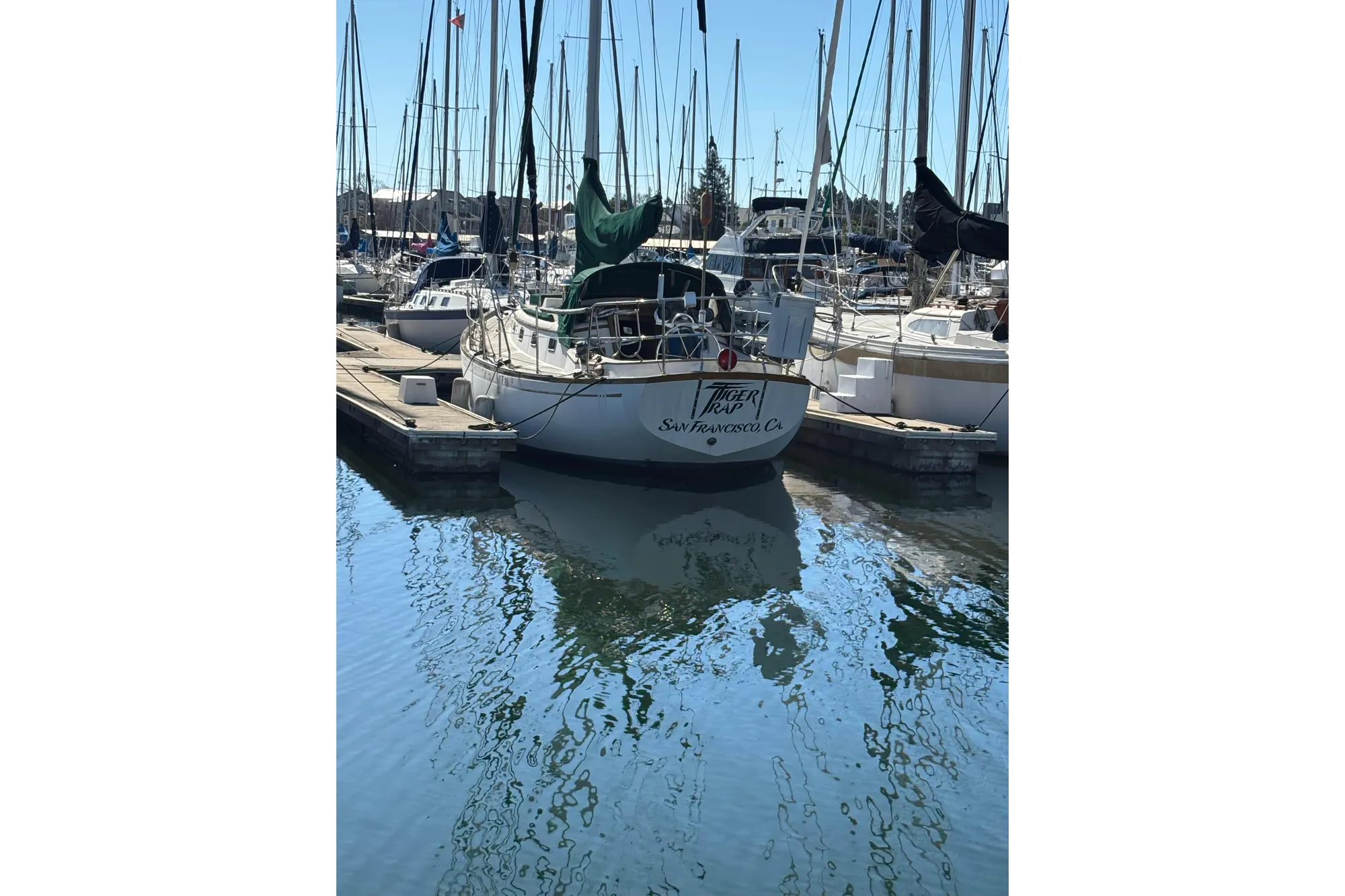 Sailboat "Tiger Trap" docked in marina, Mason 33 model, 1985, San Francisco, CA.