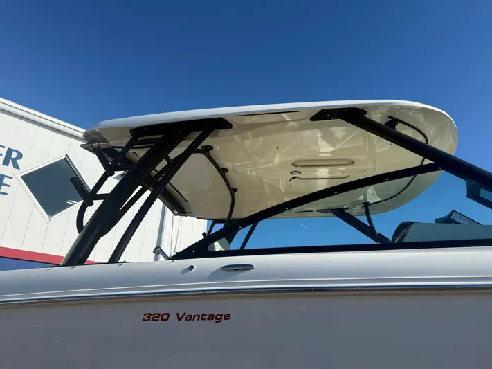  Yacht Photos Pics Boston Whaler 320 Vantage 2022 with blue sky background.