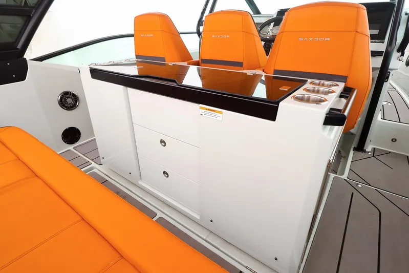  Yacht Photos Pics 2023 Saxdor 320 GTO interior with orange seats and modern console design.