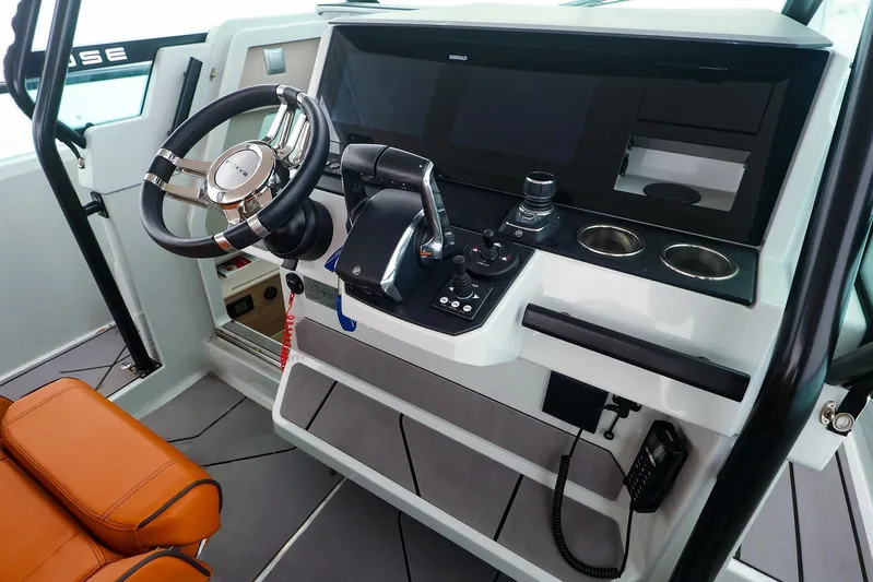  Yacht Photos Pics 2023 Saxdor 320 GTO helm with modern controls and leather seating.