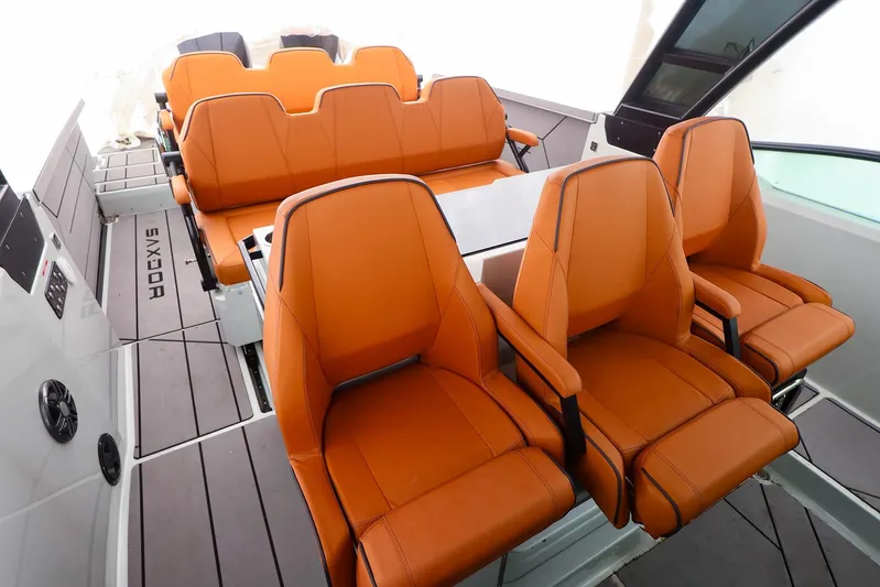  Yacht Photos Pics 2023 Saxdor 320 GTO interior with orange seating and modern design.