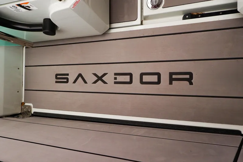  Yacht Photos Pics 2023 Saxdor 320 GTO boat deck with logo, featuring sleek design and modern aesthetics.
