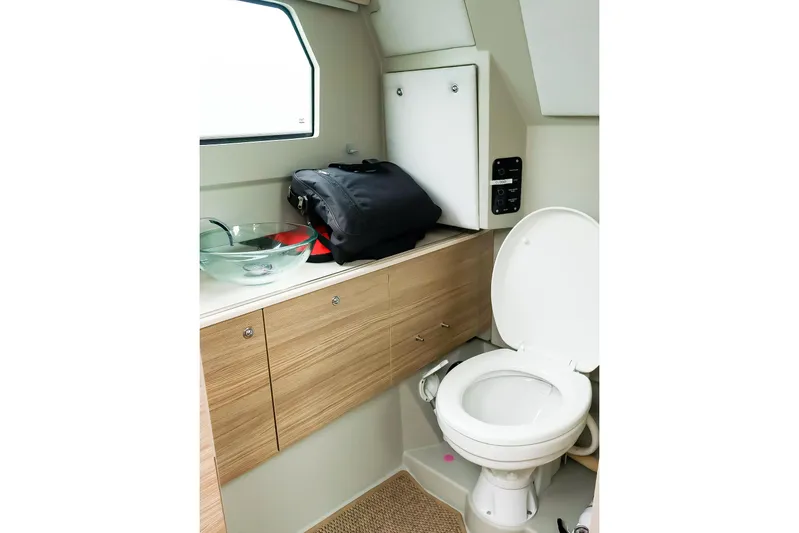  Yacht Photos Pics 2023 Saxdor 320 GTO boat bathroom with modern sink and toilet.