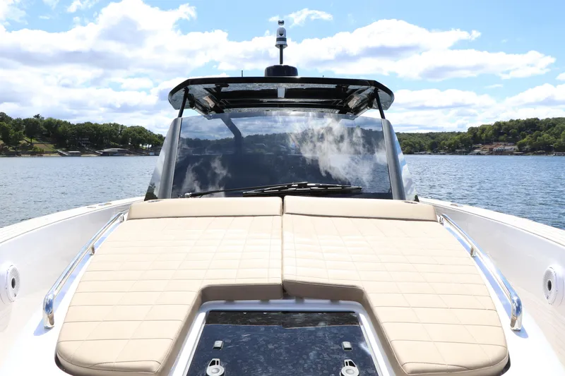  Yacht Photos Pics 2024 Pardo Yachts P43 luxury yacht with sunbathing deck on serene water.