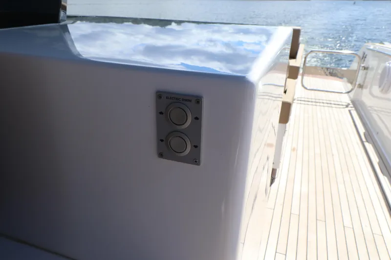  Yacht Photos Pics Pardo Yachts P43 2024 model, sleek deck design with control panel, overlooking serene waters.