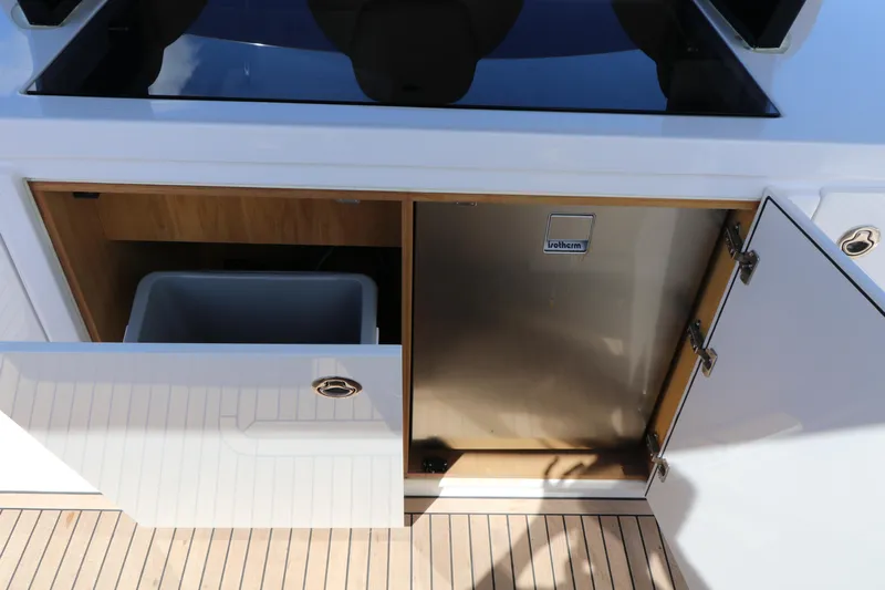  Yacht Photos Pics 2024 Pardo Yachts P43 interior with open cabinet and refrigerator.