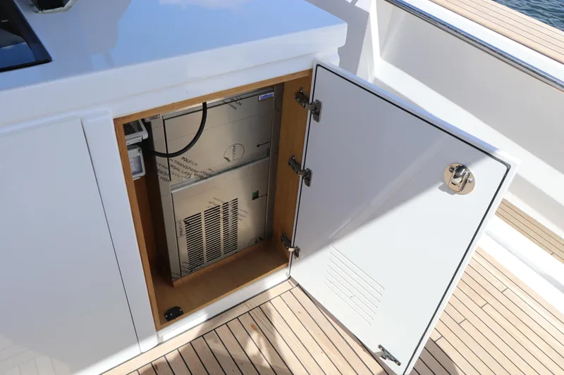  Yacht Photos Pics Open cabinet on 2024 Pardo Yachts P43, revealing interior equipment on deck.