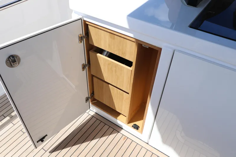  Yacht Photos Pics Open cabinet with wooden drawers on 2024 Pardo Yachts P43 deck.