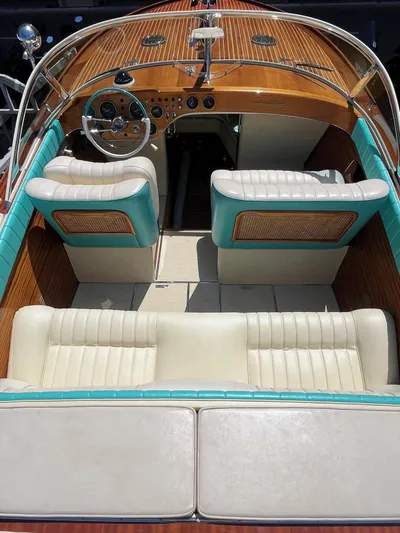 Turquoise Yacht Photos Pics 1974 Riva Aquarama Special boat interior with classic wood and teal accents.