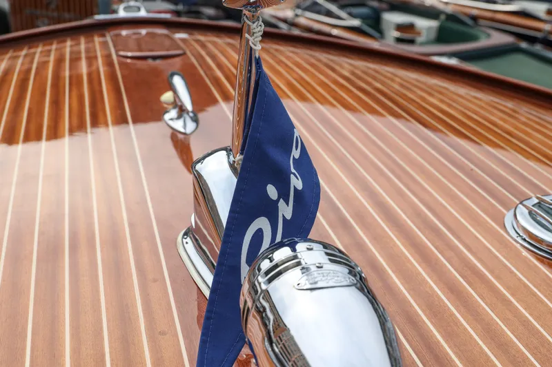 Turquoise Yacht Photos Pics 1974 Riva Aquarama Special boat with polished wood deck and chrome details.