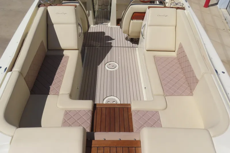  Yacht Photos Pics 2018 Chris Craft Launch 34 boat interior with beige seating and wooden flooring.