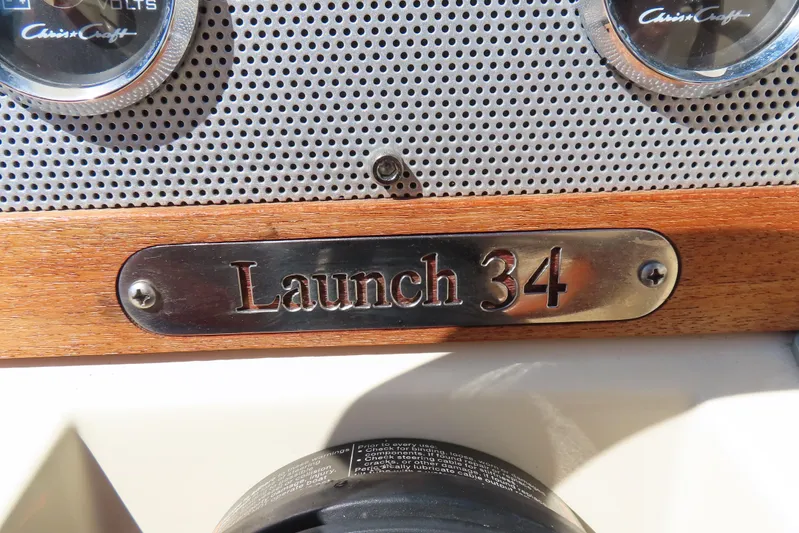  Yacht Photos Pics 2018 Chris Craft Launch 34 dashboard with wood and metal detailing.