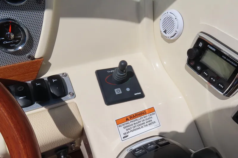  Yacht Photos Pics 2018 Chris Craft Launch 34 dashboard with controls, gauges, and warning label.