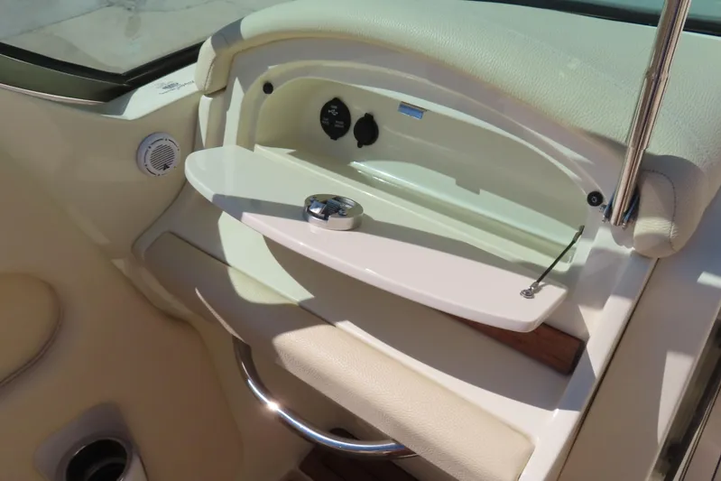  Yacht Photos Pics 2018 Chris Craft Launch 34 interior detail with storage compartment and speaker.