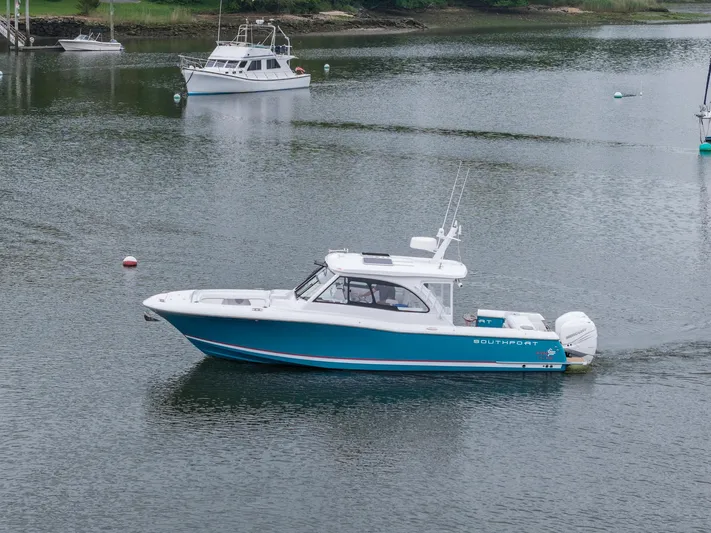 Even Flow Yacht Photos Pics 2021 Southport 33 DC boat cruising on calm water.