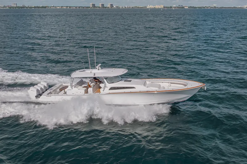  Yacht Photos Pics 2024 Valhalla Boatworks V-55 cruising on open water, showcasing sleek design and powerful engines.