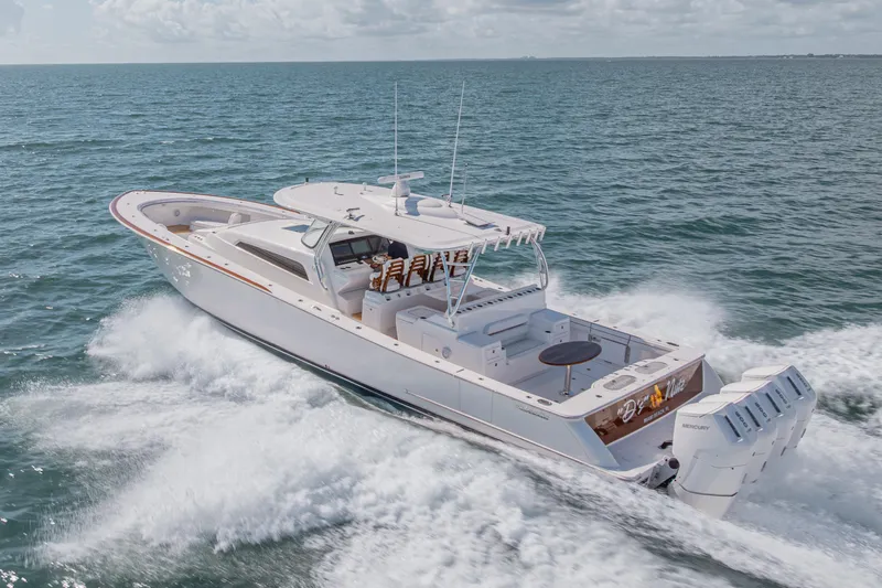  Yacht Photos Pics 2024 Valhalla Boatworks V-55 cruising on open water, showcasing sleek design and powerful engines.