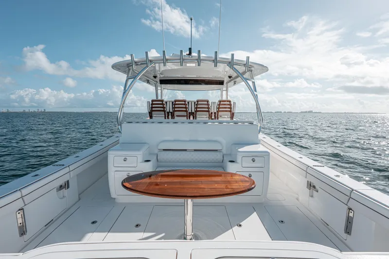  Yacht Photos Pics 2024 Valhalla Boatworks V-55 on open water, featuring sleek design and spacious deck.