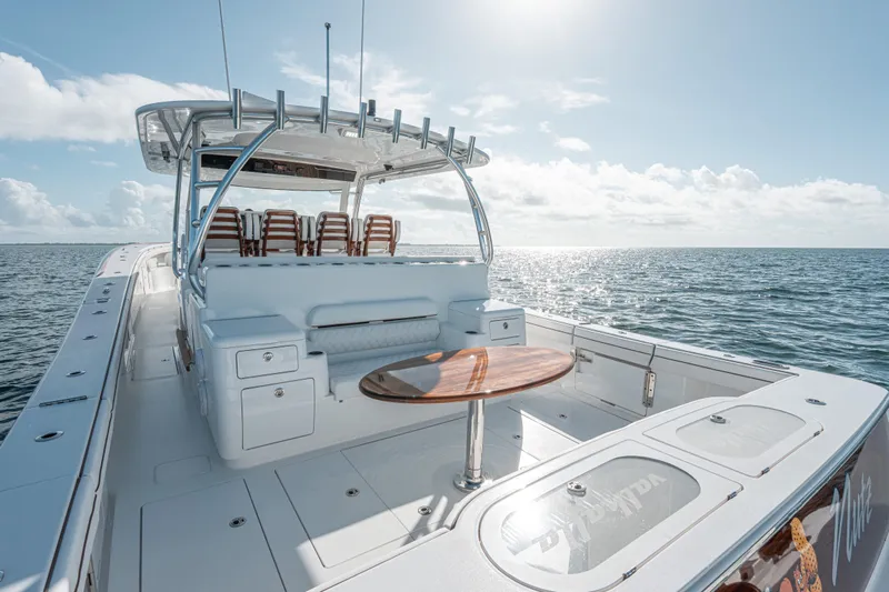  Yacht Photos Pics 2024 Valhalla Boatworks V-55 on open water, showcasing sleek design and spacious deck.