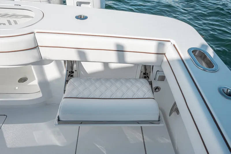  Yacht Photos Pics 2024 Valhalla Boatworks V-55 interior with white cushioned seating and sleek design.