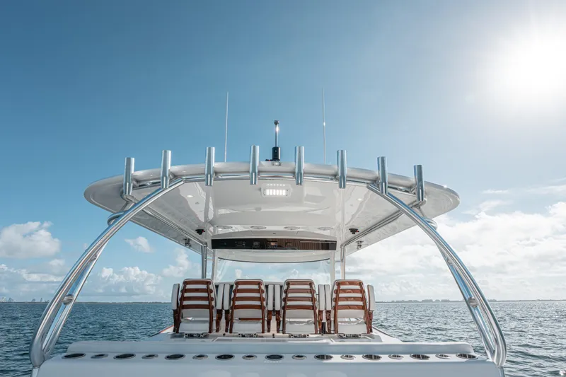  Yacht Photos Pics 2024 Valhalla Boatworks V-55 on open water under clear blue sky.
