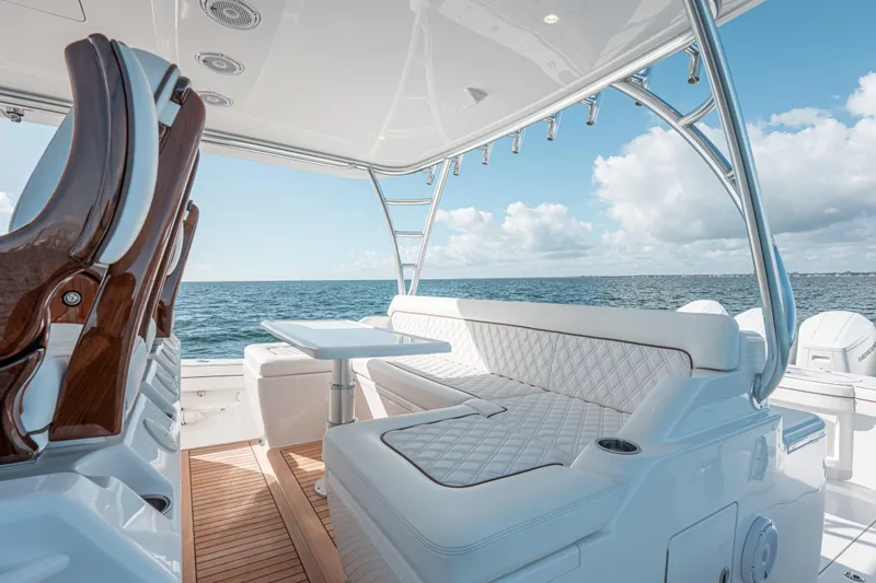  Yacht Photos Pics Luxurious 2024 Valhalla V-55 boat interior with elegant seating and ocean view.