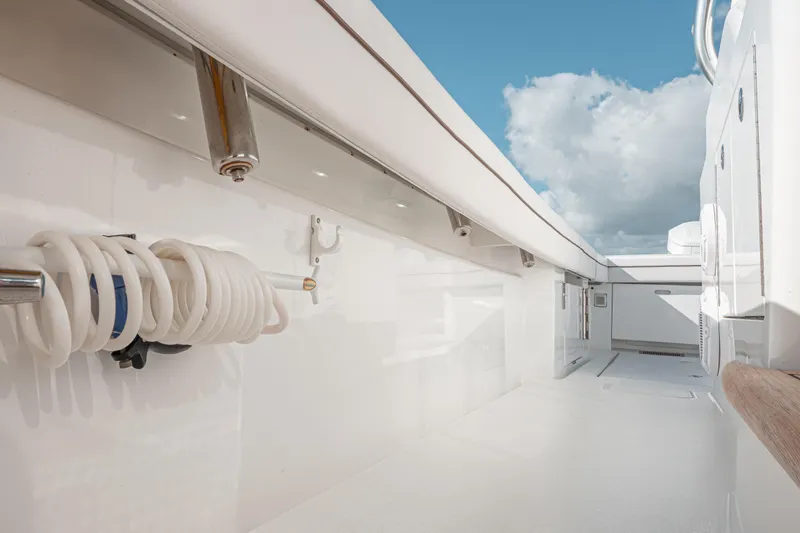  Yacht Photos Pics 2024 Valhalla Boatworks V-55 deck with coiled hose and clear sky.