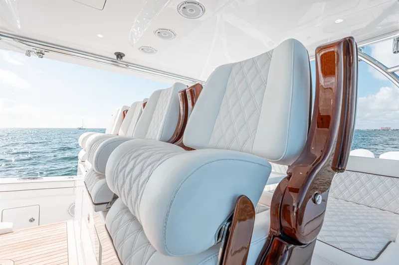  Yacht Photos Pics Luxurious seating on 2024 Valhalla Boatworks V-55, featuring elegant design and ocean view.
