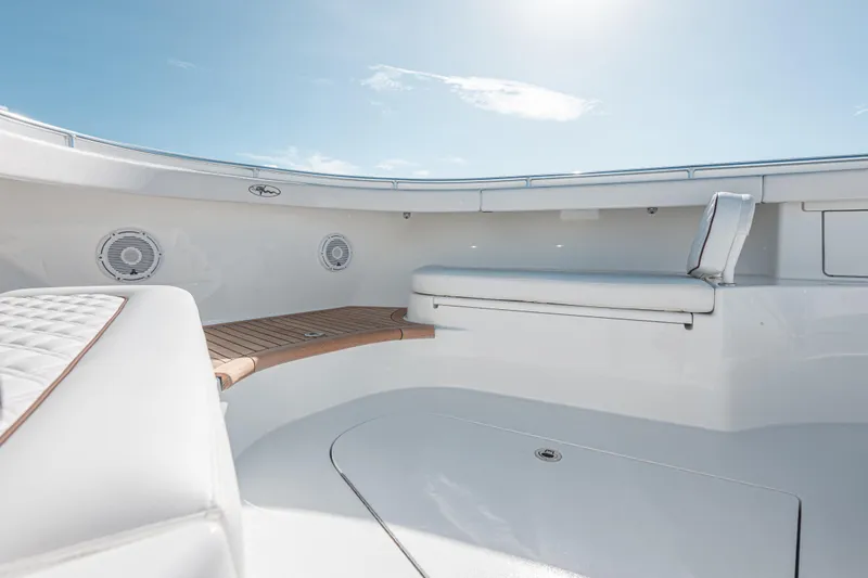  Yacht Photos Pics 2024 Valhalla Boatworks V-55 interior with cushioned seating and sleek design.