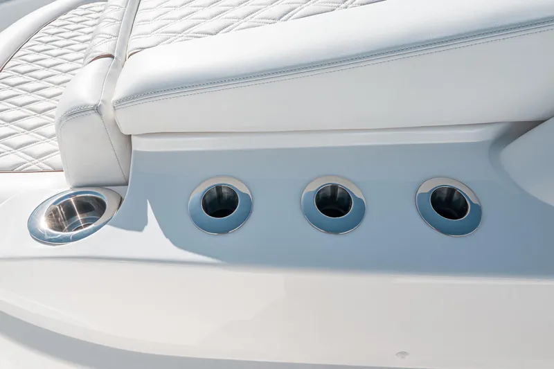  Yacht Photos Pics 2024 Valhalla Boatworks V-55, featuring luxurious white seating and stainless steel cup holders.