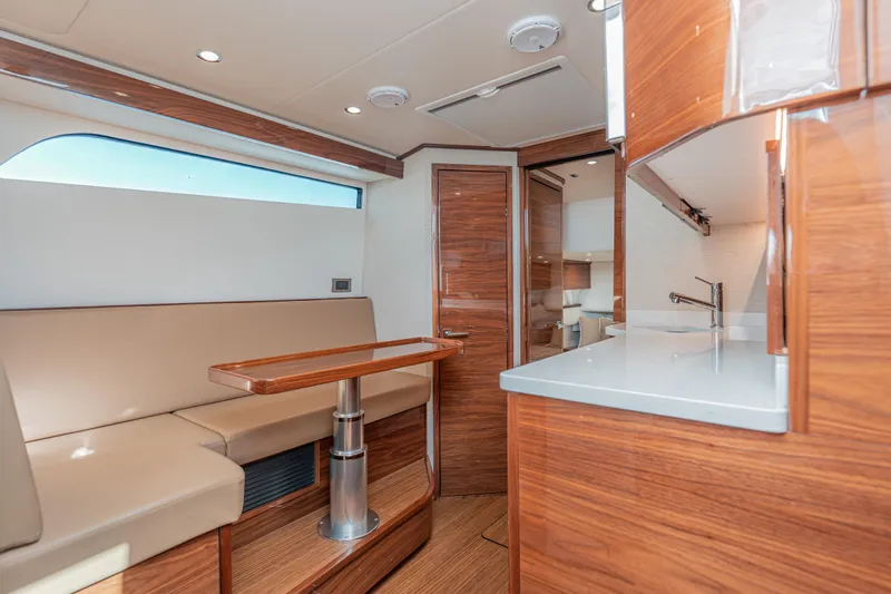  Yacht Photos Pics Luxurious interior of 2024 Valhalla Boatworks V-55 with wood finishes and modern amenities.