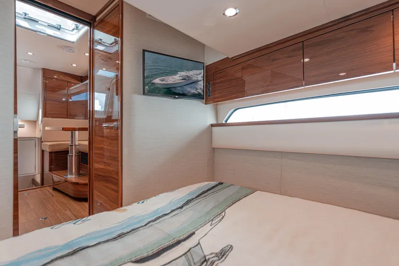  Yacht Photos Pics Luxurious interior of 2024 Valhalla Boatworks V-55 with wood finishes and modern design.