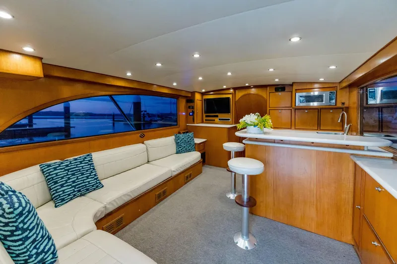 Seacario Yacht Photos Pics Luxurious 2001 Custom Carolina Sportfish yacht interior with elegant seating and modern amenities.