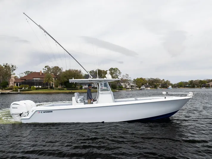  Yacht Photos Pics 2022 Contender 35 ST boat cruising on a scenic waterway.