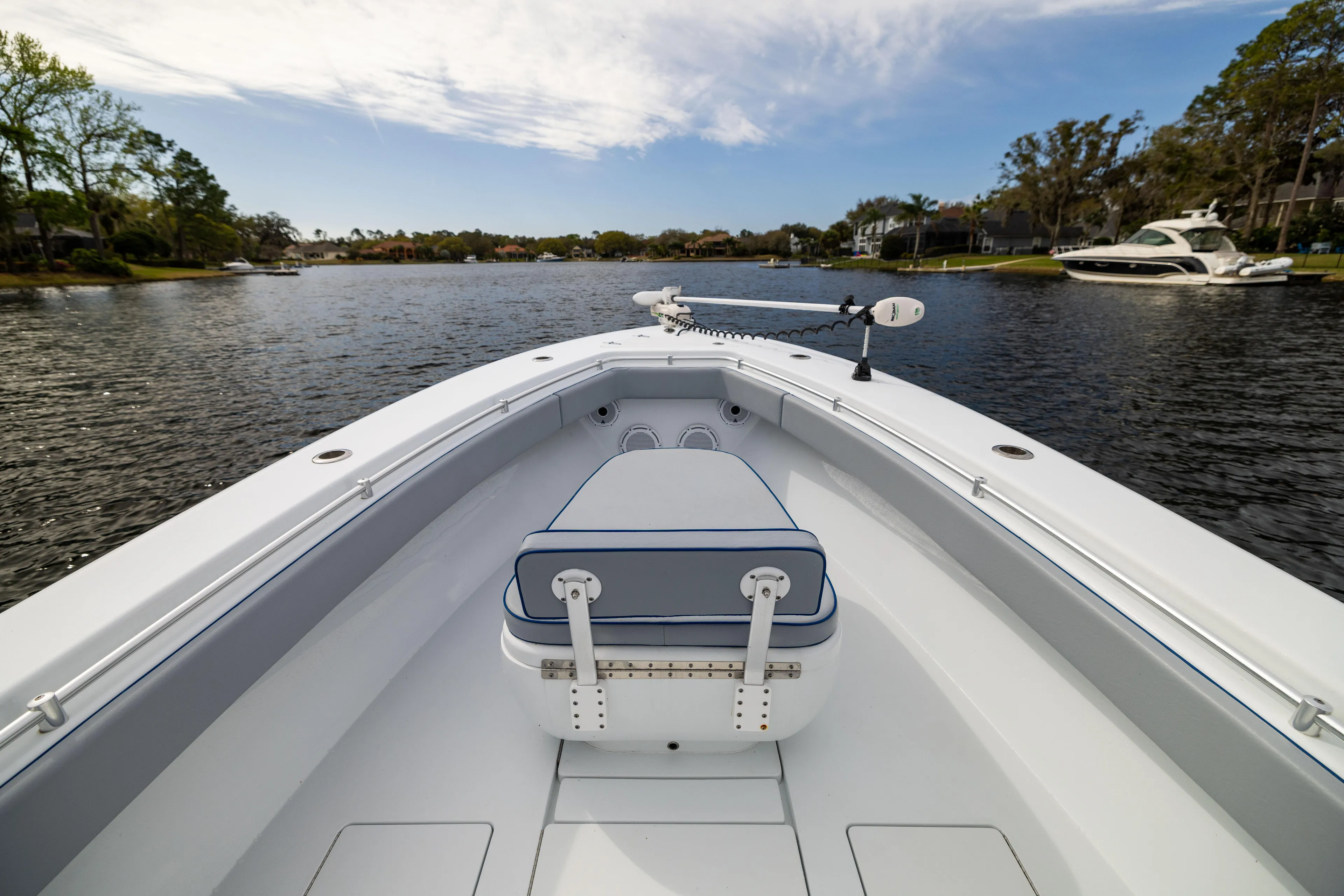  Yacht Photos Pics 2022 Contender 35 ST boat on calm water, showcasing sleek design and spacious deck.