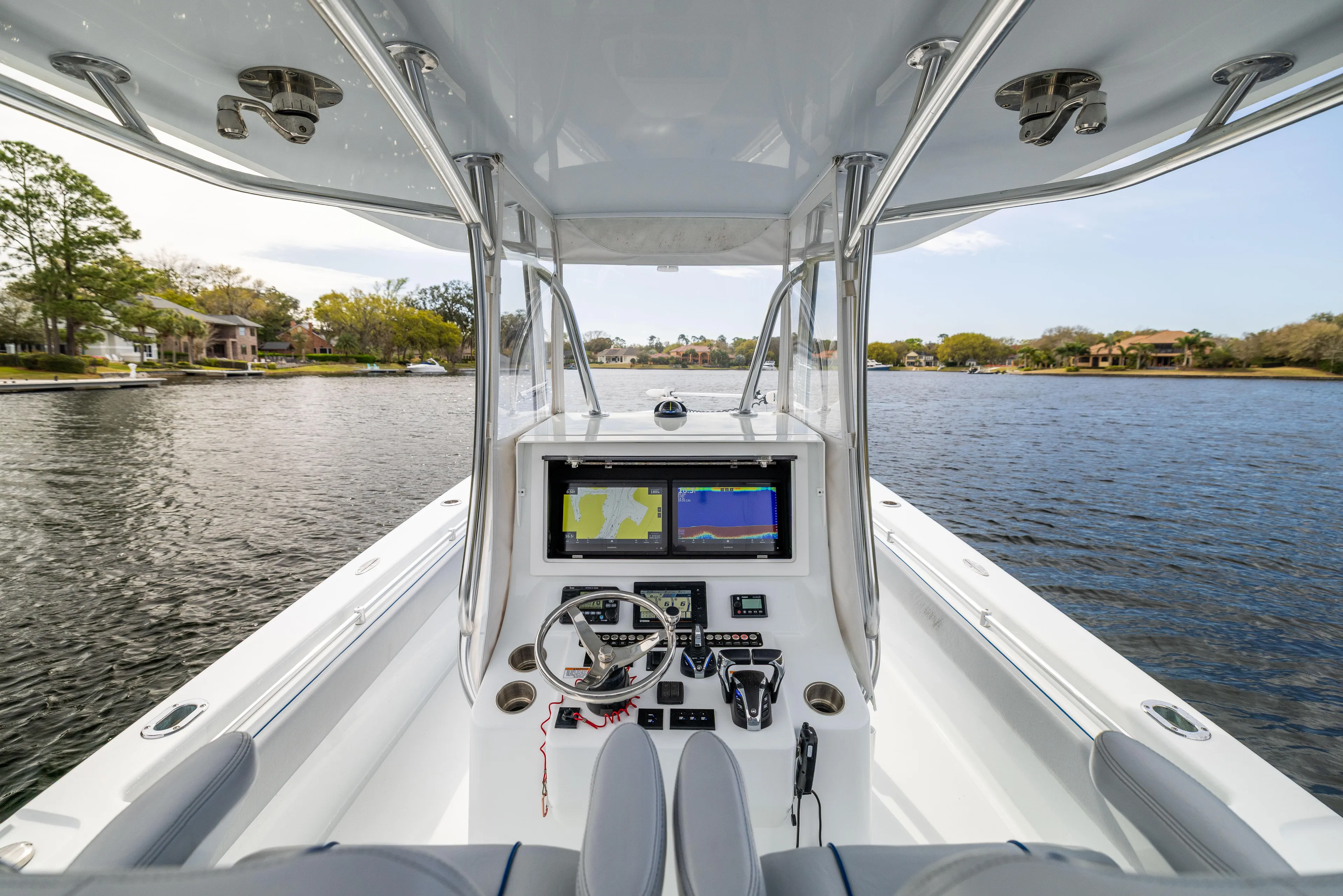  Yacht Photos Pics Center console of 2022 Contender 35 ST boat on a scenic lake.