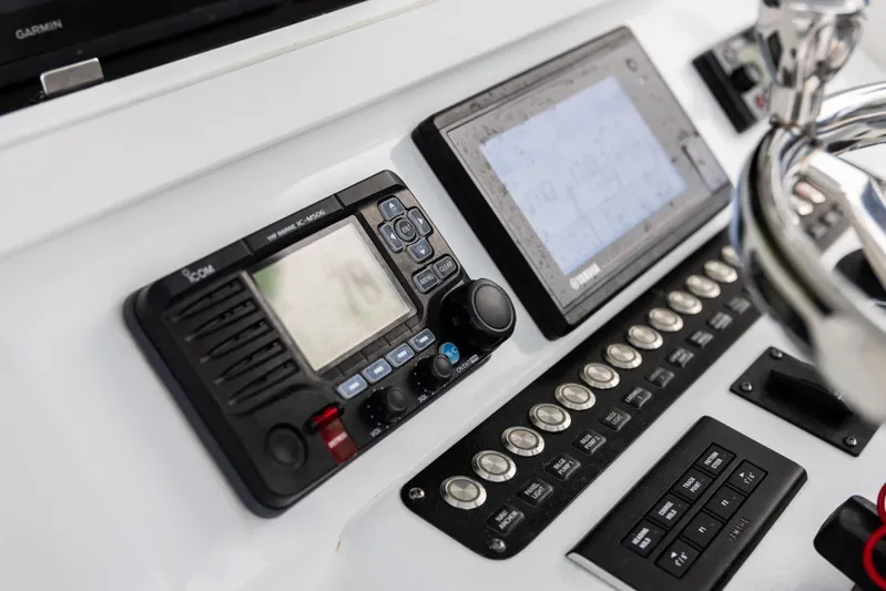  Yacht Photos Pics Control panel of 2022 Contender 35 ST boat with navigation and communication equipment.