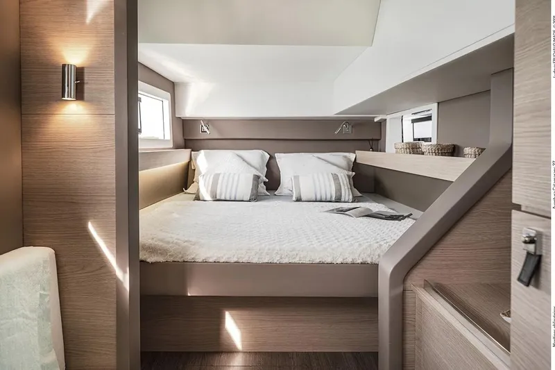  Yacht Photos Pics Luxurious interior of 2025 Aventura 37 Trawler with cozy bed and modern design.