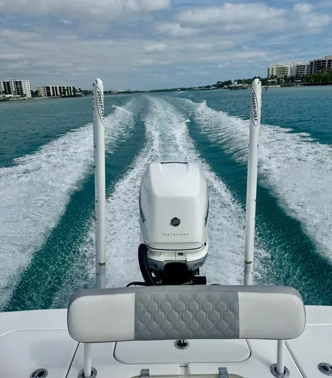  Yacht Photos Pics 2022 ZCB 26 Freemason boat cruising on turquoise water, leaving a wake behind.