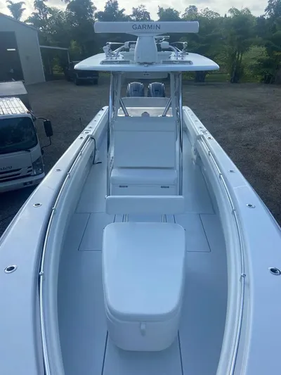  Yacht Photos Pics 2024 Contender 35 ST boat with Garmin equipment, parked outdoors.