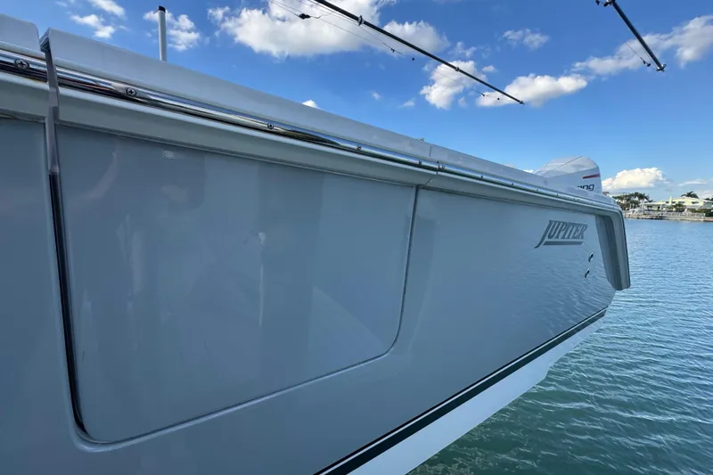 High Steaks Yacht Photos Pics 2024 Jupiter 38 HFS boat side view on water under blue sky.