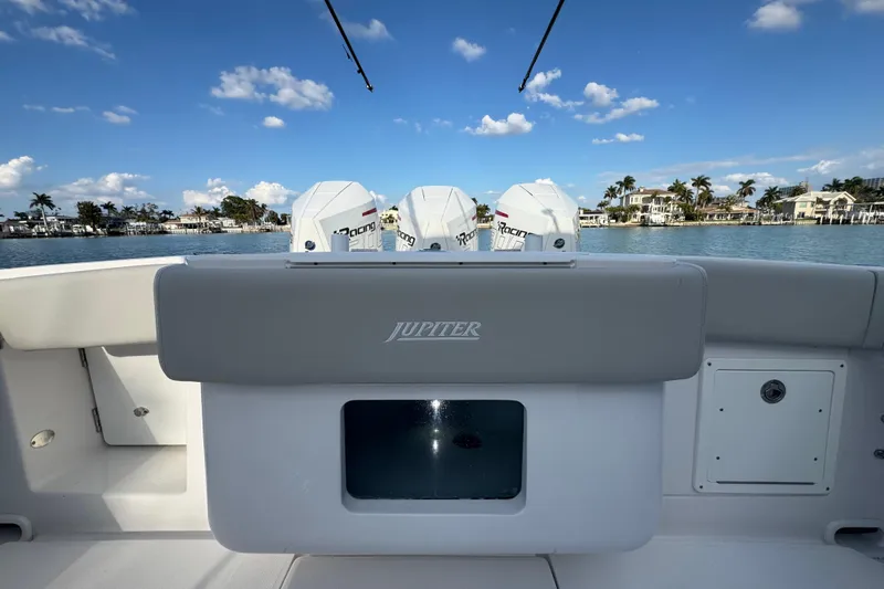 High Steaks Yacht Photos Pics 2024 Jupiter 38 HFS boat with triple outboard engines on a sunny day.