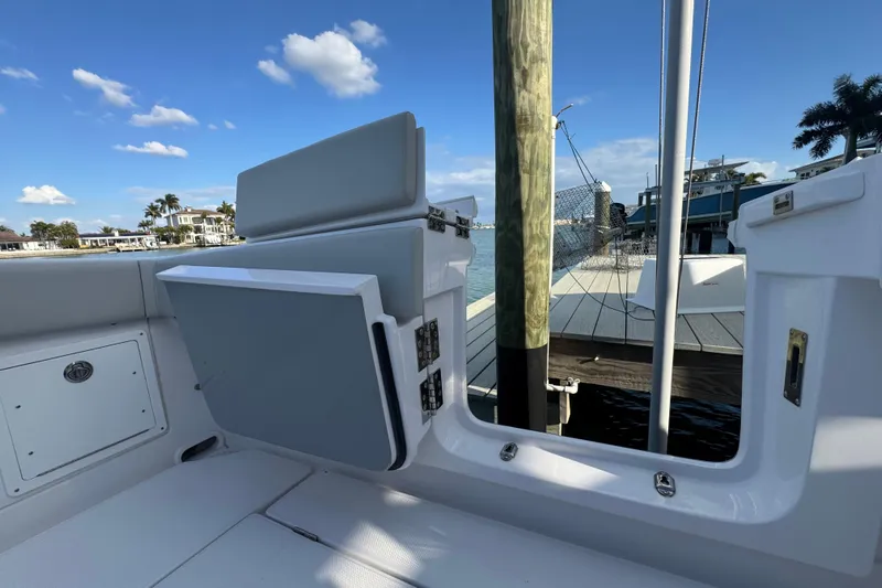 High Steaks Yacht Photos Pics 2024 Jupiter 38 HFS boat interior with open hatch, dockside view, and clear blue sky.