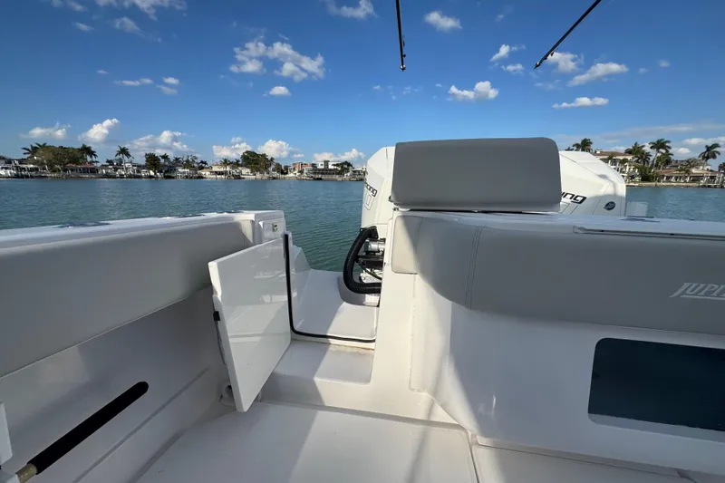 High Steaks Yacht Photos Pics 2024 Jupiter 38 HFS boat on calm water with clear blue sky.