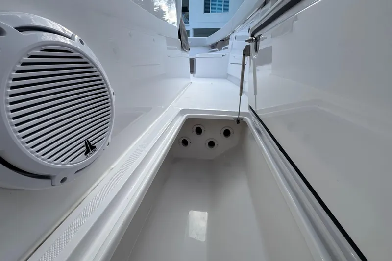 High Steaks Yacht Photos Pics 2024 Jupiter 38 HFS boat interior with speaker and storage compartment.