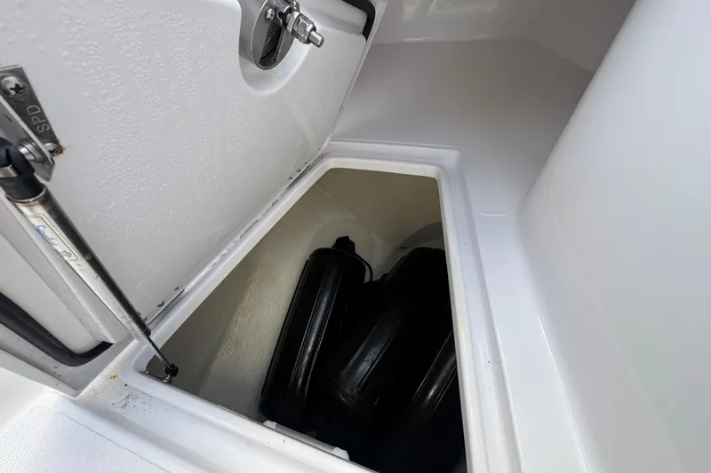 High Steaks Yacht Photos Pics Storage compartment on 2024 Jupiter 38 HFS boat, featuring secure latch and hydraulic support.