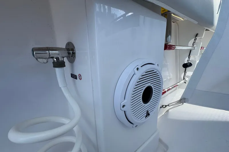 High Steaks Yacht Photos Pics 2024 Jupiter 38 HFS boat interior with speaker and coiled hose.