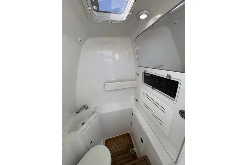 High Steaks Yacht Photos Pics 2024 Jupiter 38 HFS boat interior with modern bathroom amenities and wooden flooring.